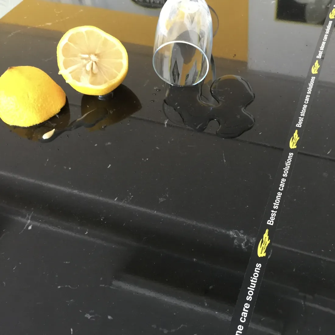 Lemon on black marble treated with antiacid protection